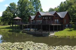 Secluded 51-Acre Retreat: 2 Cabins, Pond & Gardens - Image 2