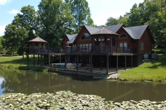 Secluded 51-Acre Retreat: 2 Cabins, Pond & Gardens - Image 2