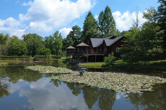Secluded 51-Acre Retreat: 2 Cabins, Pond & Gardens - Image 4