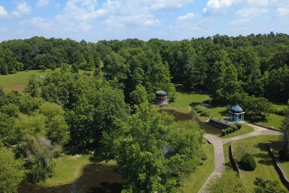Secluded 51-Acre Retreat: 2 Cabins, Pond & Gardens - Image 1